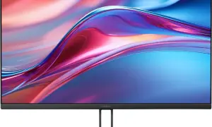 Monitor Xiaomi z ekranem 2k rozdzielczość, wyświetlający abstrakcyjny wzór w odcieniach niebieskiego, różowego i czerwonego.